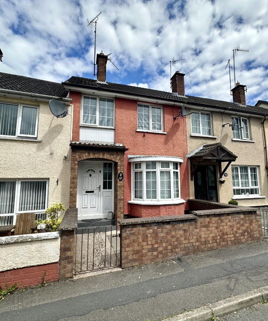 A typical Georgian street in Armagh, Callan Street, with traditional terraced houses and parked cars.